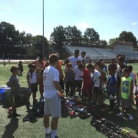 <p>Brendan Vann distributed soccer balls, cleats and shinguards to over 100 Paterson children.</p>