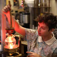 <p>A barista at Coffee Lab Roasters in Tarrytown uses an intriguing looking gadget to brew some beans. Called a siphon, it is currently the most popular way of preparing coffee in Japan.</p>