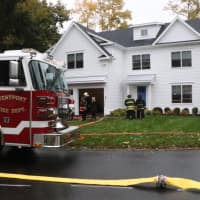 <p>Westport firefighters respond to a blaze at 9 Colonial Road on Monday morning.</p>
