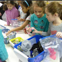 <p>West Patent Elementary School students create care packages for a community service project.</p>