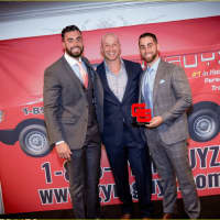 <p>James Bonavita, left, with GYMGUYZ CEO Josh York, center and Sam Langer, right, with their &quot;Franchise of the Year&quot; award.</p>