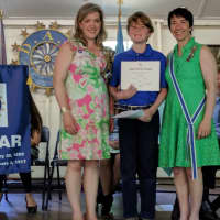 <p>Good Wife’s River Chapter DAR Essay Contest winner Connor McNamara receives a certificate and pin from CTDAR American History Chairman Catherine Bue-Hebner and CTDAR Regent Alice Ridgway at the Connecticut State DAR Board of Management Meeting</p>