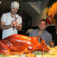 <p>Dave DiBari carving one of his favorite dishes -- pig.</p>