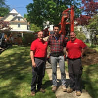 <p>Jonathan Drew of HGTV&#x27;s &quot;Property Brothers,&quot; center, poses with employees of Curti Landscaping, from left, Dave Rosenfeld and TJ Farkas.</p>