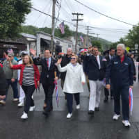 <p>Hillary Clinton, Andrew Cuomo and Bill Clinton march in the New Castle Memorial Day Parade.</p>