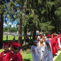 <p>Red Hook students walk to their graduation ceremony</p>