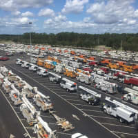<p>A convoy of Eversource trucks responding to a hurricane disaster.</p>