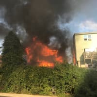 <p>One home on Alden Street in Stamford is completely consumed by flames on Monday afternoon. The fire broke out a block from Stamford Hospital. This photo was taken before firefighters arrived by an off-duty lieutenant.</p>