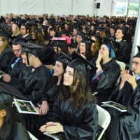 <p>Members of Sarah Lawrence College’s class of 2016 listen to commencement speakers.</p>