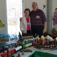 <p>Diane and Bob Adler pose with the train display at the Mahwah Public Library.</p>