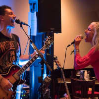 <p>Friend and guest Gillian Galler-Foley sings Led Zeppelin&#x27;s &quot;Rock and Roll&quot; with Doghöuse band leader Jim Marussich at the Steel Wheel Tavern.</p>