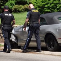 <p>The impact pushed the Mustang onto the sidewalk.</p>