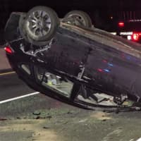 <p>The rolled-over vehicle was removed from the scene by a flatbed tow truck.</p>