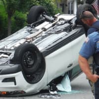 <p>SUV ends up on its roof. Airbags deploy. Driver walks away.</p>