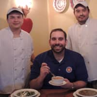 <p>Gene Bazzarelli, general manager of Franco&#x27;s Metro, with two of his kitchen staff.</p>