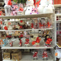 <p>A shelf of brightly-colored Valentine&#x27;s Day themed gifts.</p>