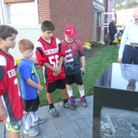 <p>Pictured from left: Ashton El-Ansara, 10; Quinn Sureda, 7; Jack Insera, 12; and Jake Falotico, 10 reflecting on the new memorial.</p>