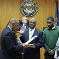 <p>Englewood Councilman-at-Large Charles Cobb takes the oath of office.</p>