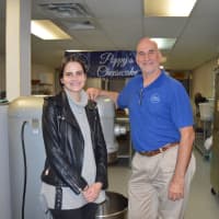 <p>Katie and Tom Ginis in the kitchen at Poppy&#x27;s Cheesecake of Bridgeport.</p>