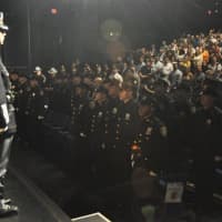<p>Westchester County Police Sgt. Edward Devlin of the Police Academy brings the 141st Session and the audience to attention to begin Friday&#x27;s graduation ceremony at SUNY Purchase College in Harrison. There are 31 new law enforcement officers.</p>