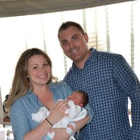 <p>Kate and John Procaccini with baby Mila Joy</p>