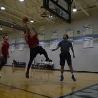 <p>A player goes up for a lay-up.</p>