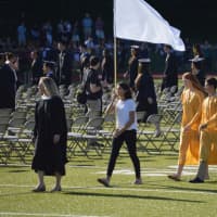 <p>The graduating class begins to make its way onto the field for the Trumbull High commencement.</p>