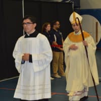 <p>Bridgeport Bishop Frank J. Caggiano enters the graduation ceremony for Immaculate High School.</p>