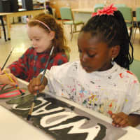 <p>Pictured are Ally Kennedy and Logan Kennedy enjoying an art project in the DAC Visual Arts Studio.</p>