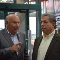 <p>Mount Kisco Mayor Michael Cindrich (left) talks with Mitch Modell, CEO of Modell&#x27;s Sporting Goods.</p>