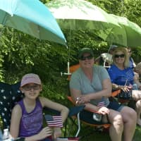 <p>Parade watchers trying to stay cool Sunday in Monroe.</p>