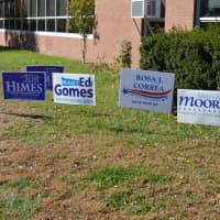 <p>Signs encourage voters outside Wilbur Cross High School in Bridgeport.</p>