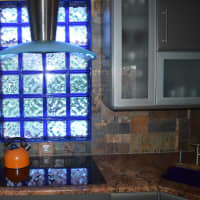 <p>One of five stained glass windows in LaMattina&#x27;s house is above the kitchen sink.</p>