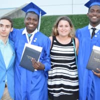 <p>Happy graduates with diplomas in hand at the Immaculate graduation</p>