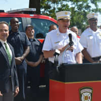 <p>Bridgeport Fire Chief Richard Thode speaks about the new safety truck while Mayor Joe Ganim, left, looks on.</p>