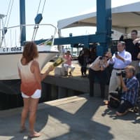 <p>Cheryl Backer, sister of the late Soundkeeper Terry Backer, christens Save the Sound&#x27;s new boat after her brother.</p>