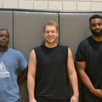 <p>From left: Arcadia Mbagaya, Eric Kamback and former Oakland Raiders and MHS football player Kevin Haslam.</p>