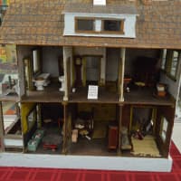 <p>An old-fashioned hand-made dollhouse.</p>