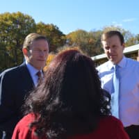 <p>U.S. Sens. Richard Blumenthal and Chris Murphy and state Sen. Marilyn Moore chat with voters outside Wilbur Cross School Tuesday.</p>