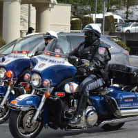 <p>Westchester County Police on motorcycles ride in the Mount Kisco St. Patrick&#x27;s Day parade.</p>