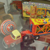<p>A circus trailer is on display in the case.</p>