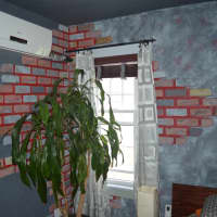<p>LaMattina painted all the walls in the house.</p>