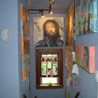 <p>The hallway leading to the stairs is filled with LaMattina&#x27;s artwork.</p>