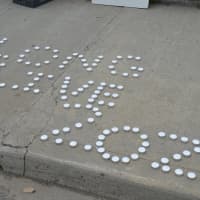 <p>Memorials lay at the site of a police officer-involved fatal shooting Tuesday night near the corner of Fairfield and Park avenues in Bridgeport.</p>