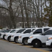 <p>A row of law-enforcement vehicles are parked diagonally on East Lake Boulevard in Mahopac in connection with the funeral for Putnam County Undersheriff Peter Convery.</p>