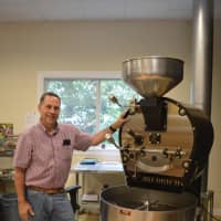 <p>Ed Freedman makes about 20 pounds of roasted coffee beans at a time at Shearwater Coffee Roasters of Trumbull.</p>