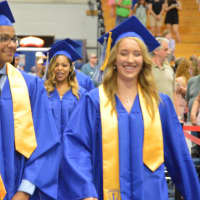 <p>Students enter the Abbott Tech High School graduation.</p>