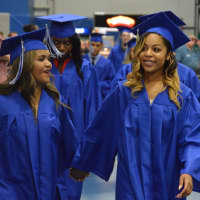 <p>Students enter the O&#x27;Neill Center for the Abbott Tech High School graduation.</p>