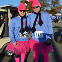 <p>Jim Perno of West Haven and Scott Bauer of East Haddam go the extra mile in dressing for the Vicki Soto 5K on Saturday in Stratford.</p>
