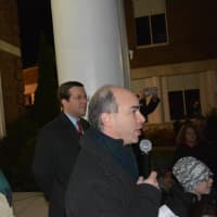 <p>Dan Taplitz (right), president of the Mount Kisco Chamber of Commerce, speaks at the tree lighting. Pictured at the left is Mount Kisco Mayor Michael Cindrich.</p>